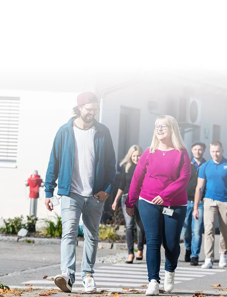 A group of ODU employees cross a crosswalk